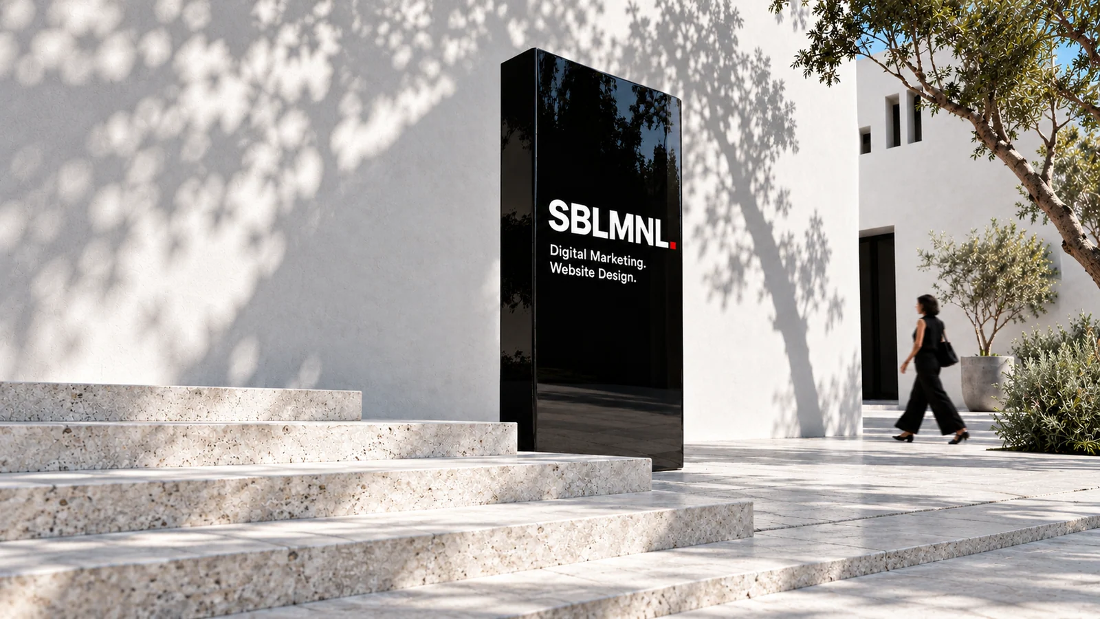 Conceptual SBLMNL business entrance with white walls and a freestanding sign.
